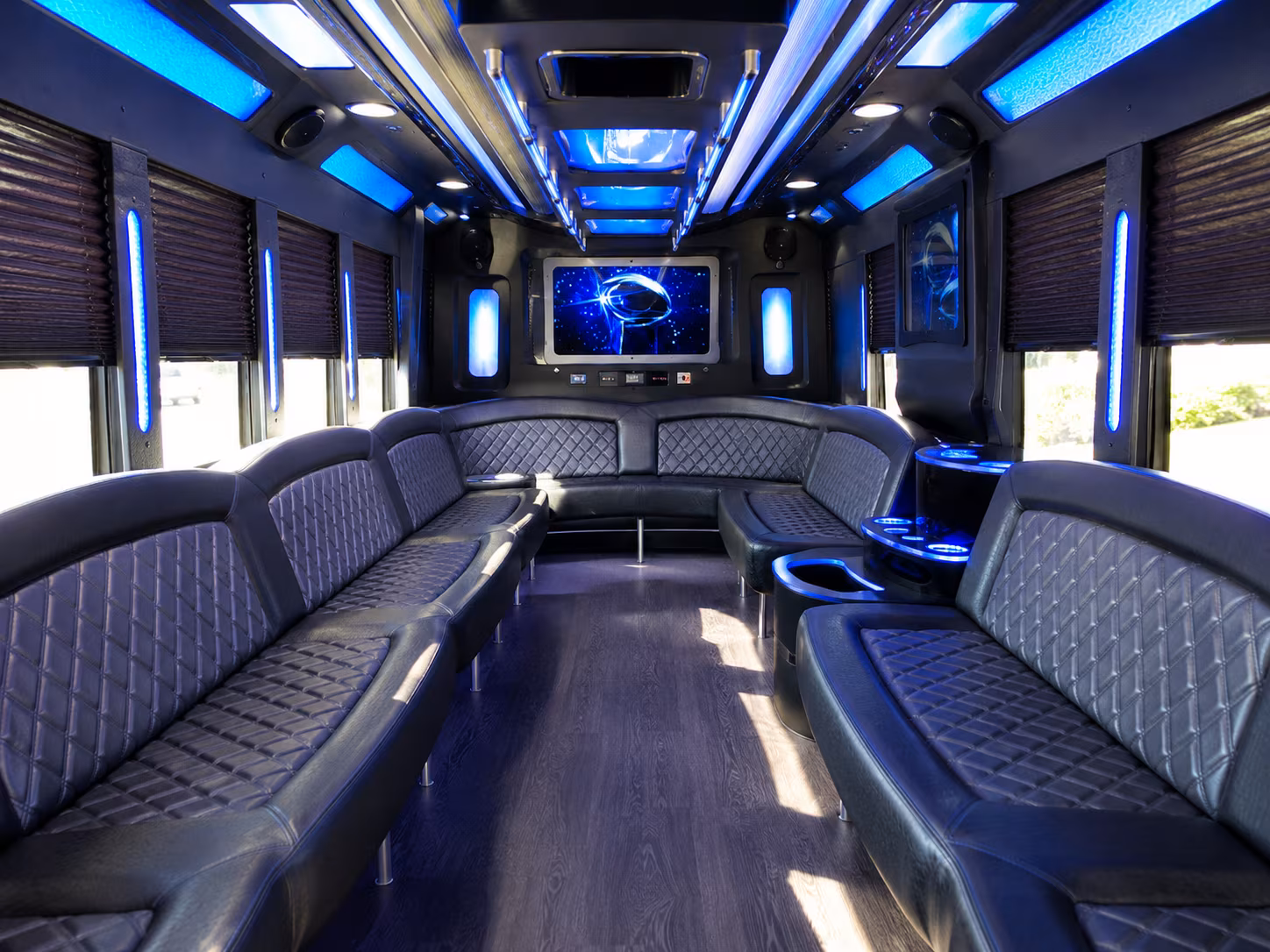 Friends laughing during a party bus celebration in Santa Maria